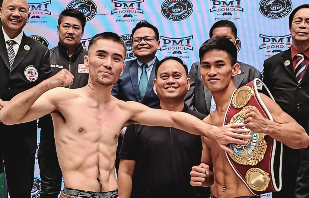 Kumong Bol-Anon 17: PH vs China Showdown in Tagbilaran set. Virgel Vitor (right) holding his WBO Oriental super featherweight belt, while his foe, Yeerjialahashi Laayibieke touches the belt as a gesture of his desire to win the title during the weigh-in on Friday. Joining them in the middle is PMI Bohol Boxing Promotions top honcho Floriezyl Echavez Podot. | Glendale Rosal 