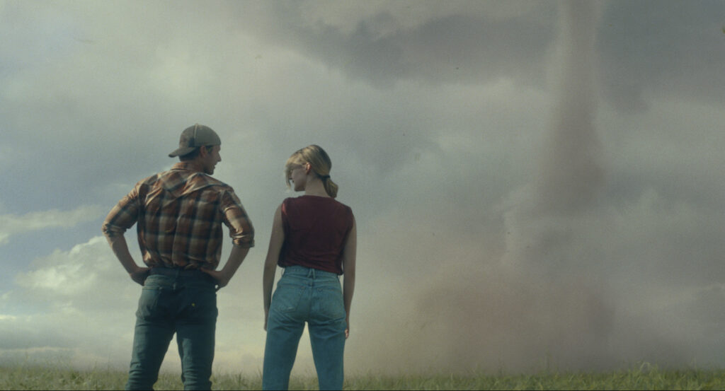 'Twisters' whips up $80.5 million at box office in North America. This image released by Universal Pictures shows Glen Powell, left, and Daisy Edgar-Jones in a scene from "Twisters." (Universal Pictures via AP)