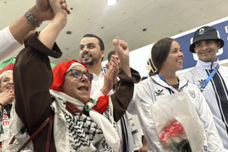 Palestinian Olympic athletes greeted with cheers, gifts in Paris