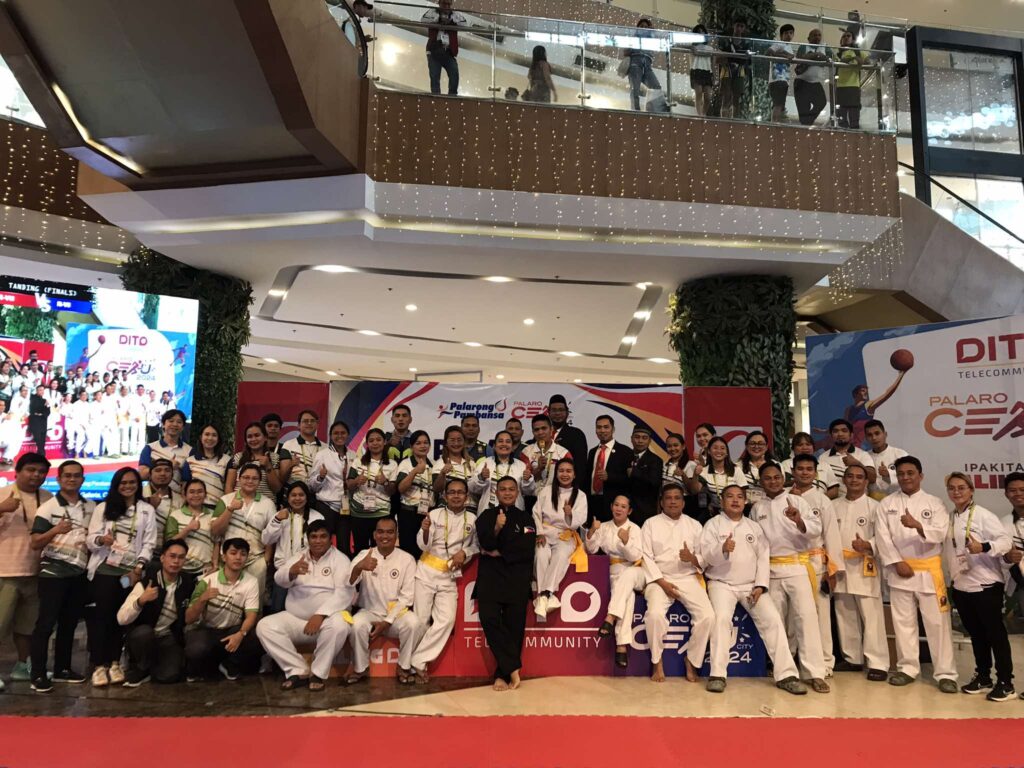 Pencak silat officials poses for a photo during the closing ceremony of the competition