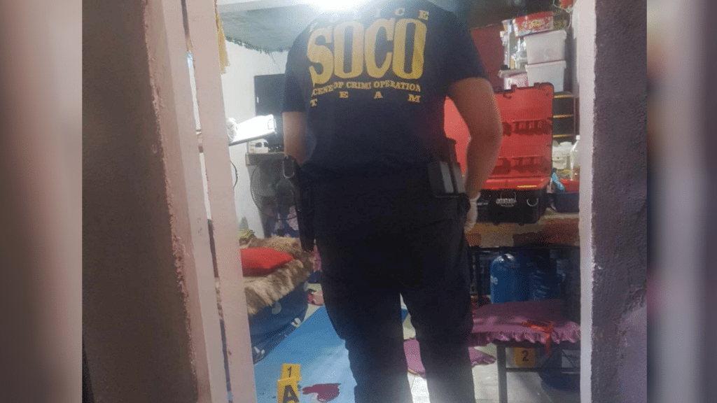 Tanod killed in his own house in Cebu City on Sunday afternoon. A member of the police's Scene of the Crime Operatives processes the crime scene where a barangay tanod was killed by two unidentified gunmen on Sunday, July 28. | Contributed photo