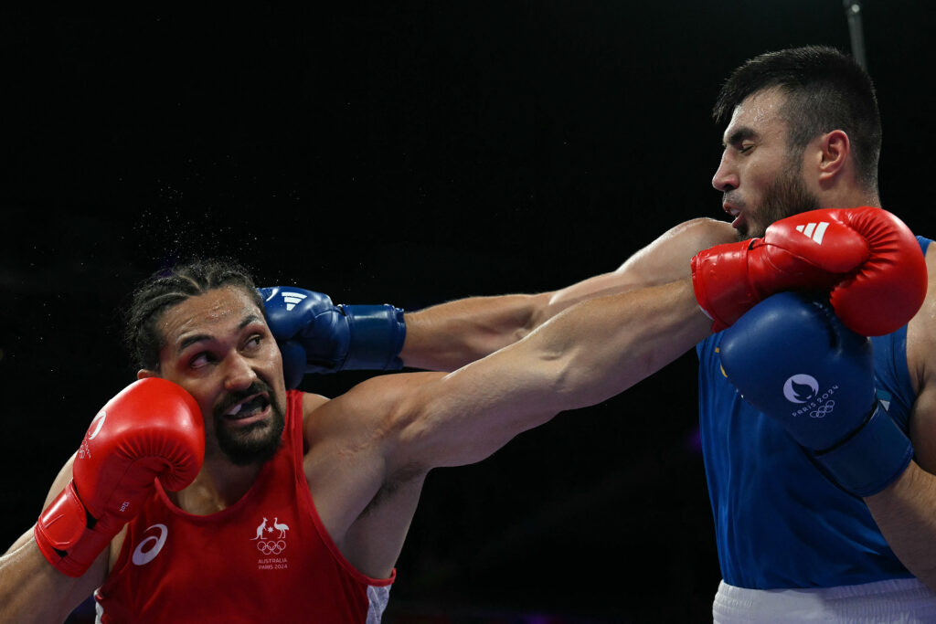 Boxing champ Jalolov ‘runs like a cat’, enters semis