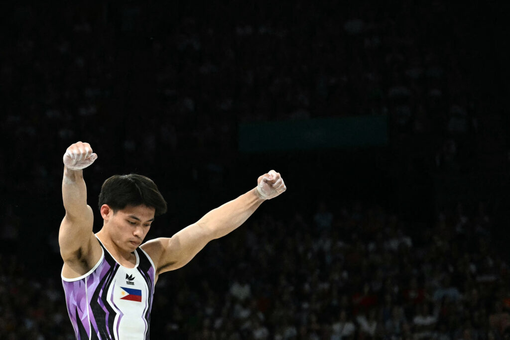 Paris Olympics: Carlos Yulo bags 2nd gold for PH in gymnastics. Philippines' Carlos Edriel Yulo reacts after competing in the artistic gymnastics men's vault final during the Paris 2024 Olympic Games at the Bercy Arena in Paris, on August 4, 2024. (Photo by Lionel BONAVENTURE / AFP)