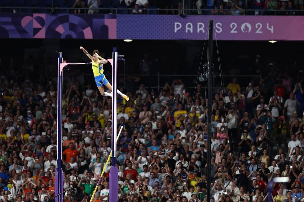 Paris Olympics: Duplantis breaks pole vault record, retains title. Sweden's Armand Duplantis competes in the men's pole vault final of the athletics event at the Paris 2024 Olympic Games at Stade de France in Saint-Denis, north of Paris, on August 5, 2024. (Photo by Anne-Christine POUJOULAT / AFP)