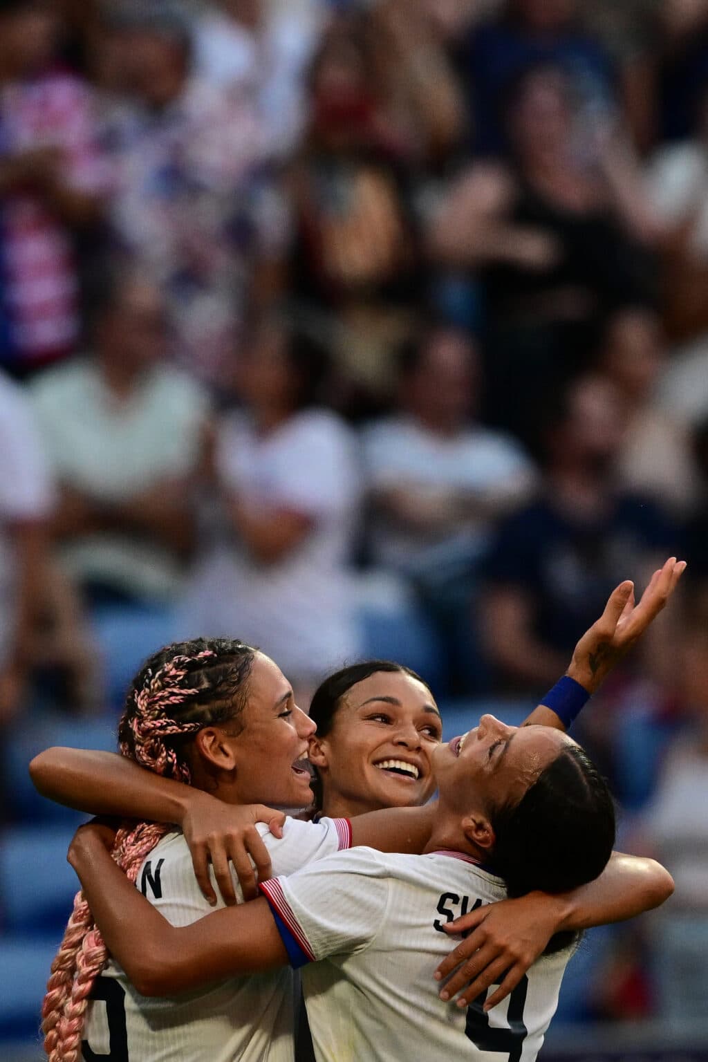 Paris Olympics: Attacking stars carry USA women to football final. US' forward #05 Trinity Rodman (L) and US' forward #09 Mallory Swanson (R) celebrate after US' forward #11 Sophia Smith (C) scored in the 95th minute during the women's semi-final football match between USA and Germany during the Paris 2024 Olympic Games at the Lyon Stadium in Lyon on August 6, 2024. (Photo by Olivier CHASSIGNOLE / AFP)