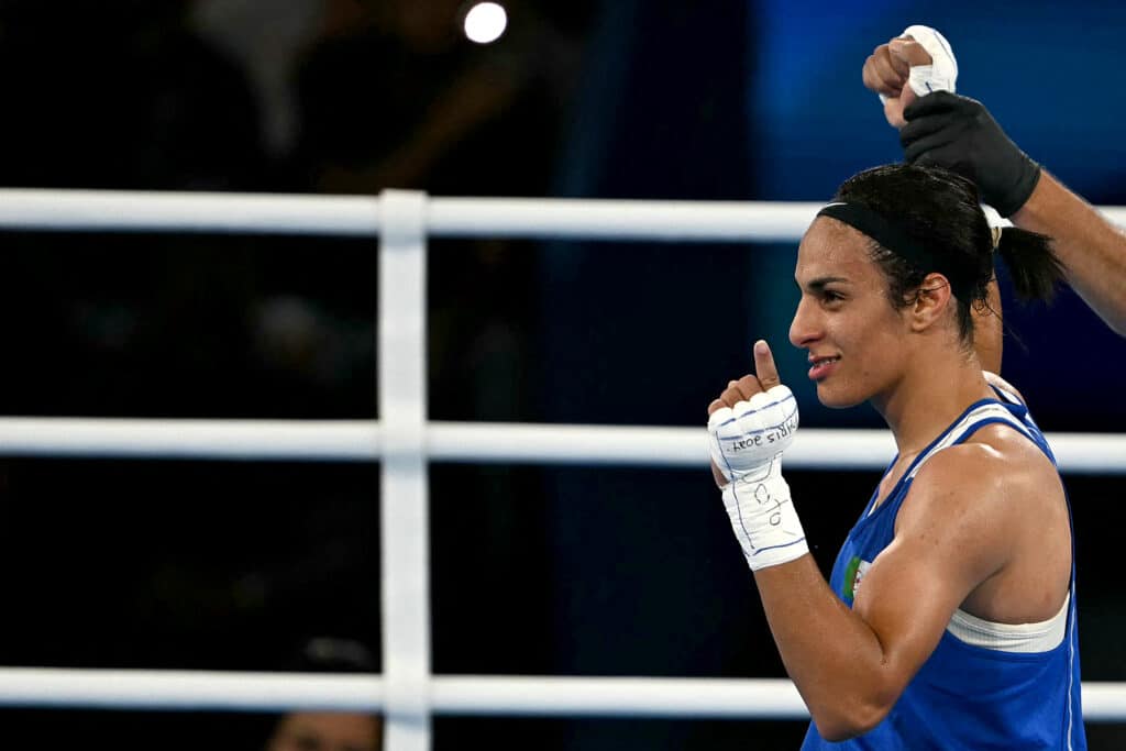 Paris Olympics: Algerian boxer in gender row marches into final. Algeria's Imane Khelif (Blue) reacts after beating Thailand's Janjaem Suwannapheng in the women's 66kg semi-final boxing match during the Paris 2024 Olympic Games at the Roland-Garros Stadium, in Paris on August 6, 2024. (Photo by Mauro PIMENTEL / AFP)