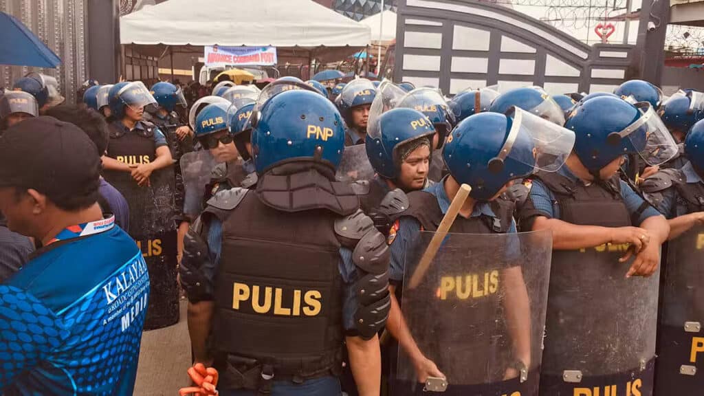 Quiboloy turf combed by 2,000 cops, no letup, vows police chief. In photo are some of the 2,000 police officers mobilized on Saturday to again serve an arrest warrant on fugitive televangelist Apollo Quiboloy, assemble outside the KOJC compound in Davao City. —Photo by Germelina Lacorte