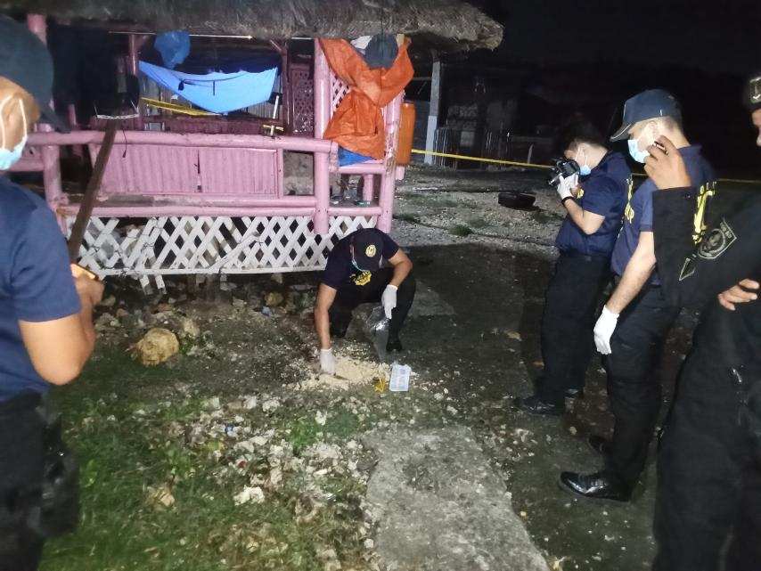 IED attack in Lapu-Lapu: 3 hurt, land dispute eyed. Police process the crime scene where an improvised explosive device landed after it was thrown by an unidentified assailant in Barangay Agus, Lapu-Lapu City. | Contributed photo via Futch Anthony Inso