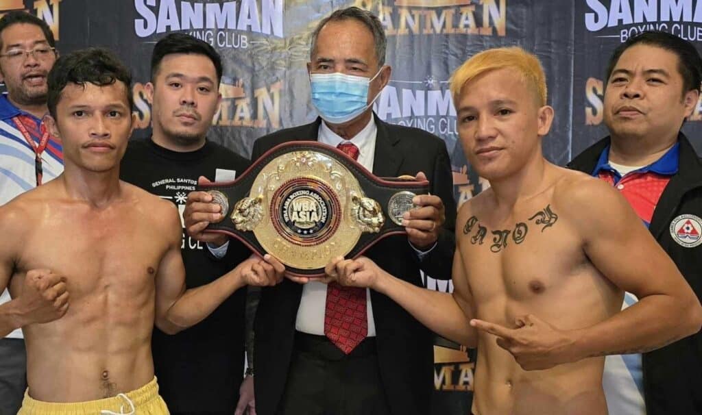 Jonathan Refugio (left) and Joey Canoy (right) face off with the WBA regional title during the official weigh-in. | Photo from Sanman Boxing.