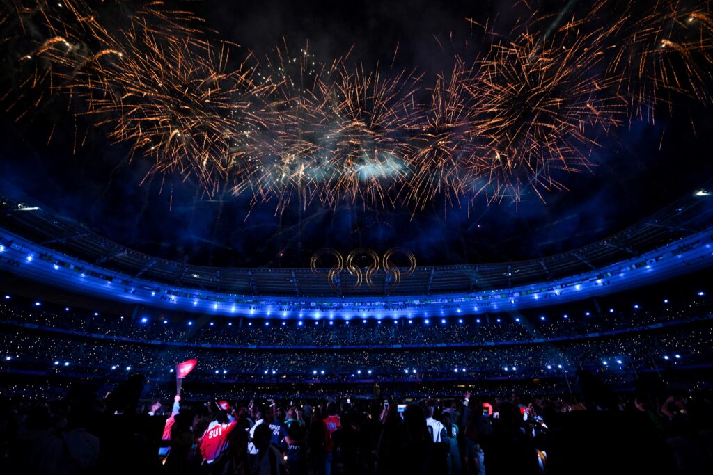 Paris closes out 2024 Olympics with final star-studded show. Fireworks sparkle behind the Olympic Rings in the sky at the end of the closing ceremony of the Paris 2024 Olympic Games at the Stade de France, in Saint-Denis, in the outskirts of Paris, on August 11, 2024. |Photo by Oli SCARFF / AFP