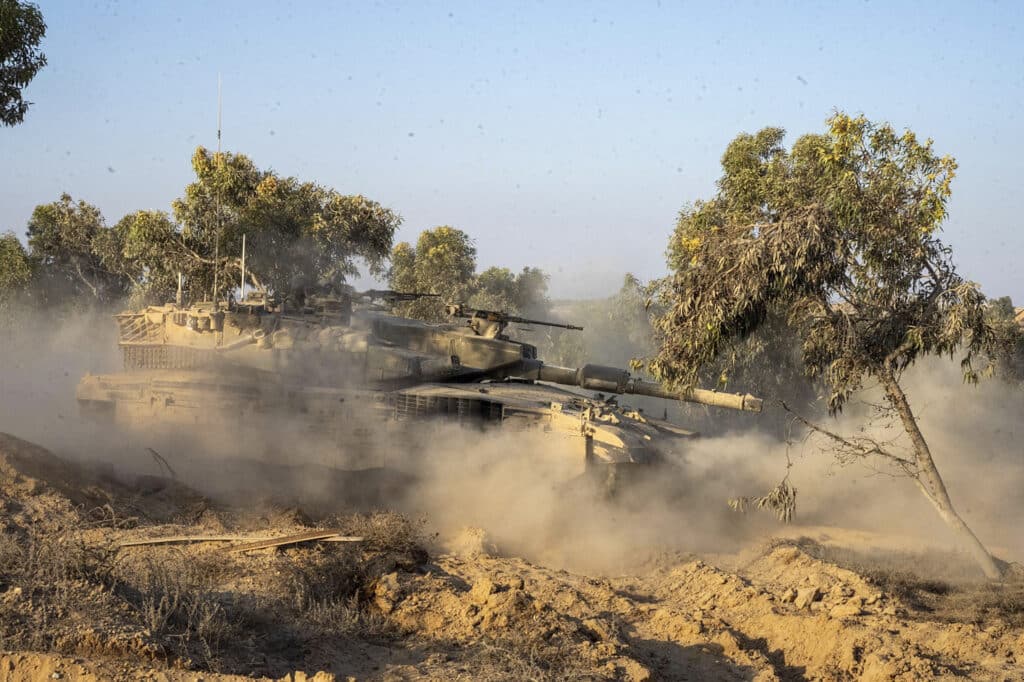 This handout picture released by the Israeli army on August 13, 2024, shows an Israeli tank rolling during operations in the Gaza Strip amid the continuing conflict between Israel and Hamas. | Photo by AFP