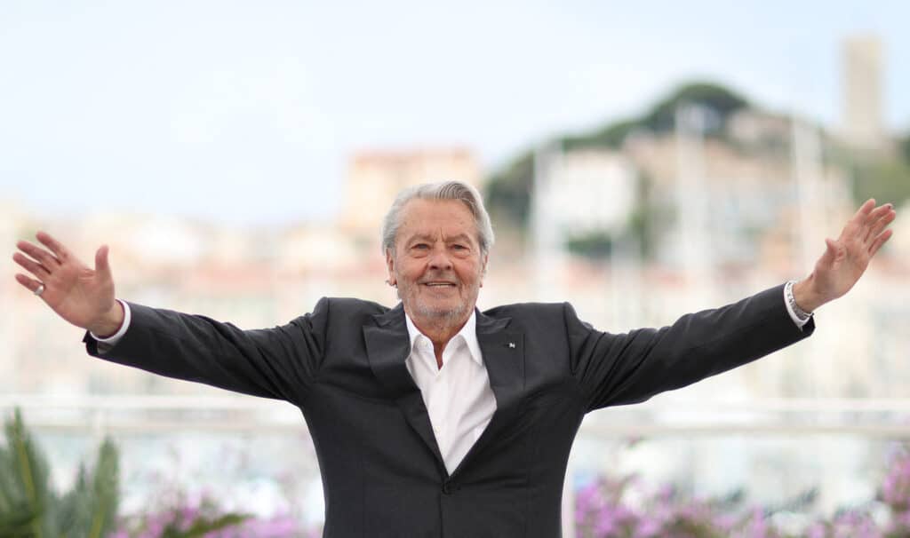 (FILES) French actor Alain Delon poses during a photocall before being awarded with an Honorary Palme d'Or at the 72nd edition of the Cannes Film Festival in Cannes, southern France, on May 19, 2019. | Photo by Valery HACHE / AFP