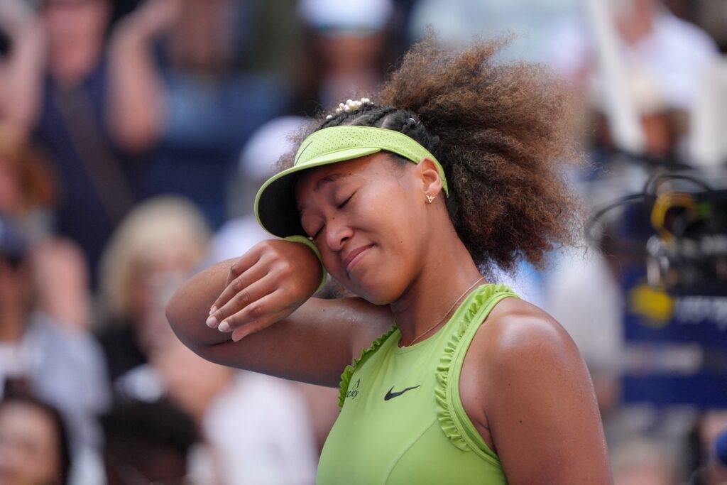 Japan's Naomi Osaka celebrates defeating Latvia's Jelena Ostapenko in their women's singles first round match on day two of the US Open tennis tournament at the USTA Billie Jean King National Tennis Center in New York City, on August 27, 2024. | Photo by TIMOTHY A. CLARY / AFP