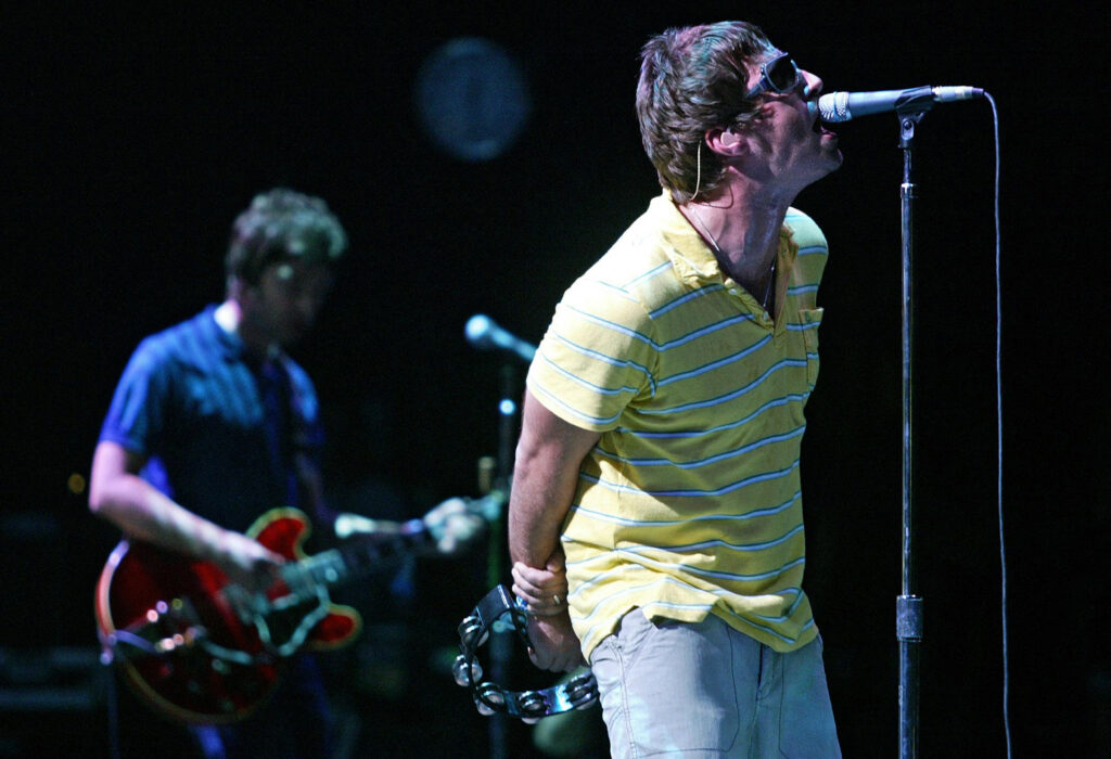 Oasis hometown abuzz after reunion tour announced. In this file photo British Liam (right) and Noel Gallagher, members of group "Oasis" are performing during their concert at the Benicasim International Festival in Benicasim, Castellon, August 7, 2005. - British rock legends Oasis announced on August 27, 2024 they will reunite for a worldwide tour next year, as brothers Liam and Noel Gallagher ended an infamous 15-year feud to unveil plans to return to the stage. | Photo by JOSE JORDAN / AFP