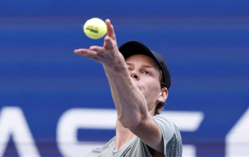 US open: Sinner, Swiatek survive 1st round wobbles, Osaka weeps. Italy's Jannik Sinner serves the ball to USA's Mackenzie McDonald during their men's singles first round match on day two of the US Open tennis tournament at the USTA Billie Jean King National Tennis Center in New York City, on August 27, 2024. | Photo by Kena Betancur / AFP