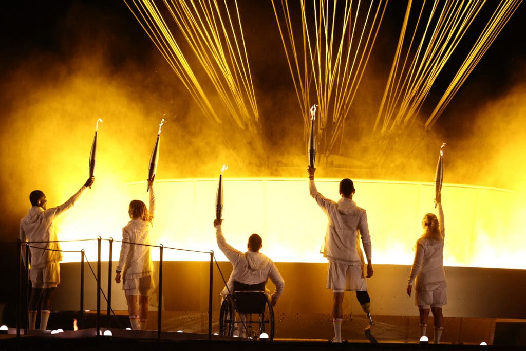 Paris Paralympics open in blaze of hope and inclusivity. France's paralympic torchbearers, Charles-Antoine Kaoukou (from left), Nantenin Keita, Fabien Lamirault, Alexis Hanquinquant and Elodie Lorandi hold the Paralympic flame in front of the Paralympic cauldron during the Paris 2024 Paralympic Games Opening Ceremony at the Jardin des Tuileries (Tuileries Garden) in Paris on August 28, 2024. | Photo by Franck FIFE / AFP