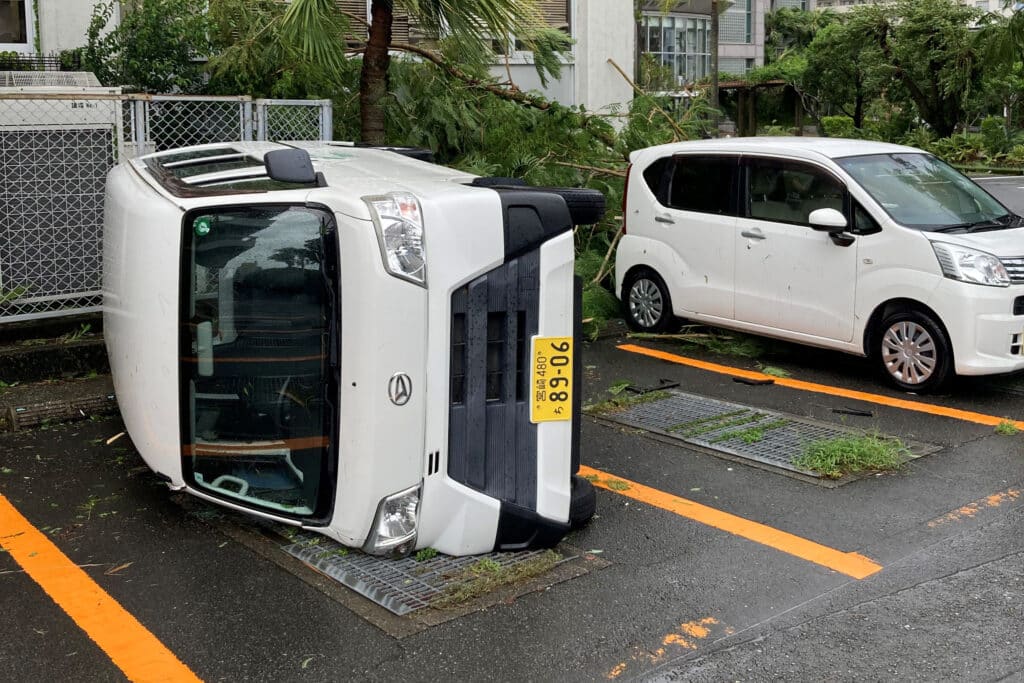 Japan battered by powerful Typhoon Shanshan, 5 deaths reported. This handout photo taken and released by Miyazaki City Hall on August 29, 2024 shows a car overturned by strong winds from Typhoon Shanshan in Miyazaki. | Photo by Handout / Miyazaki City Hall / AFP