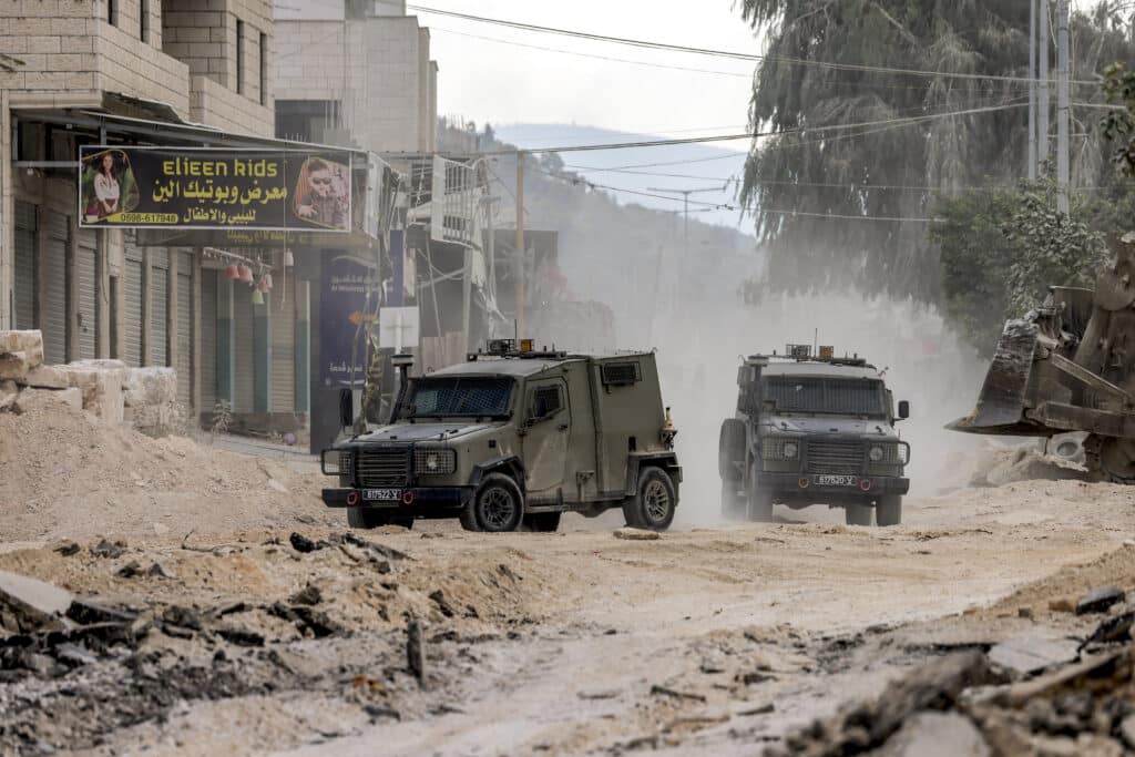 Israel's West Bank raid stuns Palestinians: ‘We are another Gaza’. In photo are Israeli army armoured vehicles moving along a road during a military operation in Tulkarm in the north of the occupied West Bank on August 29, 2024. | Photo by Jaafar ASHTIYEH / AFP