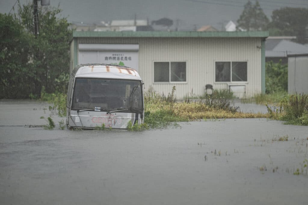 Japan battered by powerful Typhoon Shanshan, 5 deaths reported. In photo is a bus, which is seen submerged in floodwaters in Yufu city of Oita prefecture on August 29, 2024, when Typhoon Shanshan dumps torrential rains across southern regions of Japan. | Photo by Yuichi YAMAZAKI / AFP