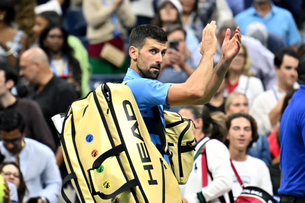 US Open shock exit: Djokovic bows to Australian Poporin. In photo is Serbia's Novak Djokovic waving at the crowd after his defeat against Australia's Alexei Popyrin during their men's singles third round match on day five of the US Open tennis tournament at the USTA Billie Jean King National Tennis Center in New York City, on August 30, 2024. | Photo by ANGELA WEISS / AFP