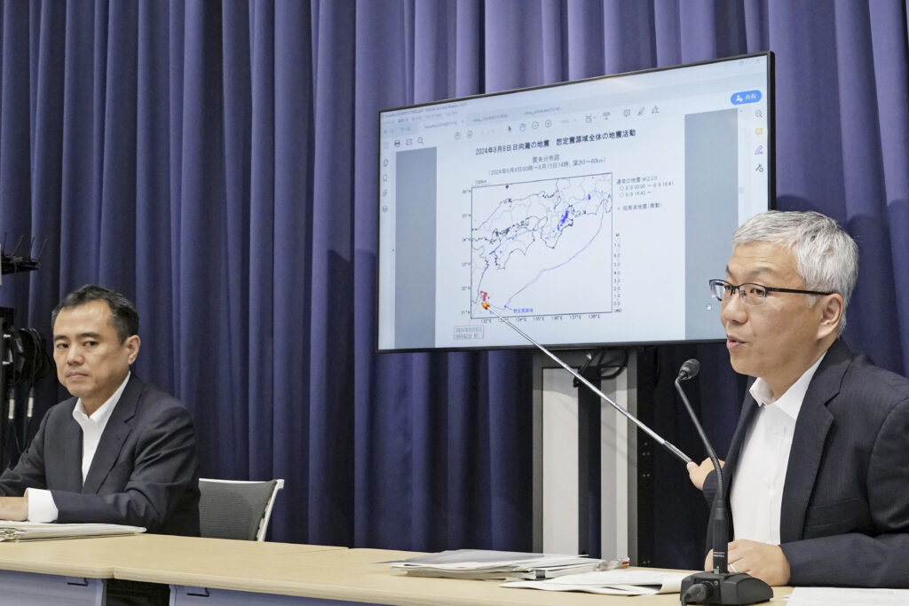 Officials from Japan Meteorological Agency and cabinet office attend a press conference to anounce the end of its weeklong drive for increased caution and preparedness for a possible megaquake striking the Pacific coast, at the agency's office in Tokyo Thursday, Aug. 15, 2024. (Kyodo News via AP)