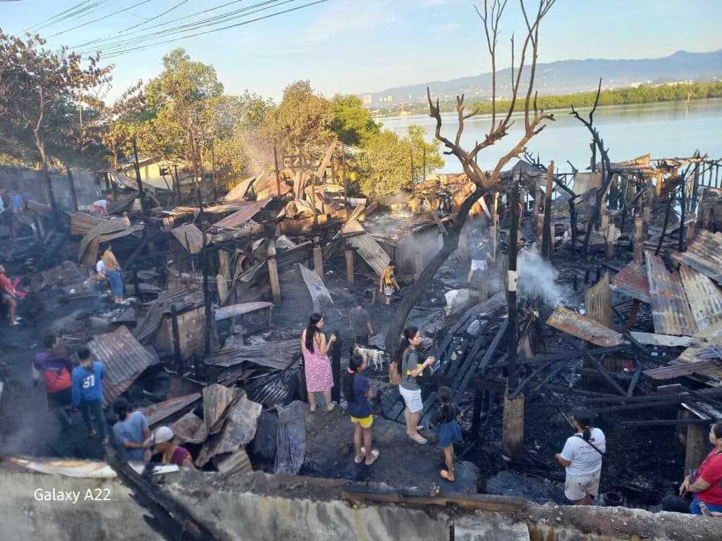 Consolacion fire: Embers of a burnt egg tray started blaze? This is the aftermath or the day after scene of the area in Consolacion town that was destroyed by fire. | dySS Super Radyo via Futch Anthony Inso