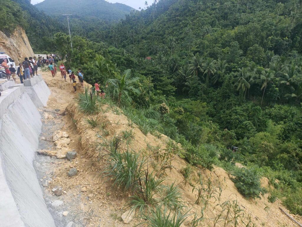 Cebu accidents: Motorcycle slams into backhoe, SUV falls off ravine. In photo are people milling around at the side of the 170-meter ravine where an SUV fell in Barangay Esperanza, Aloguinsan town in southwestern Cebu on Sunday, September 22. | Contributed photo via Paul Lauro