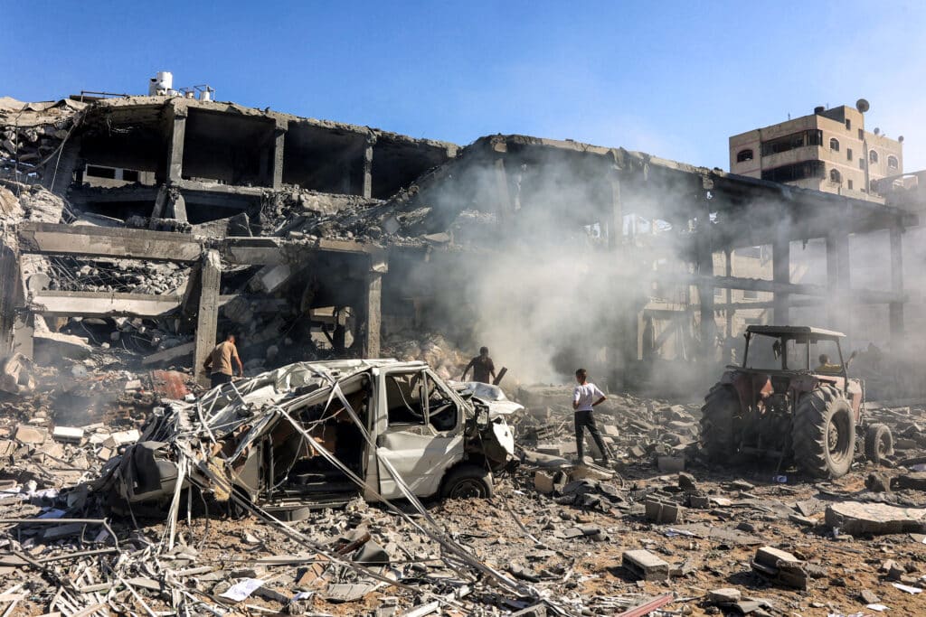 Gaza truce deal: It is time for one, says US. In photo are men walking through debris in a building that was hit by Israeli bombardment in the Sheikh Radwan neighbourhood in the north of Gaza City on September 3, 2024 amid the ongoing war in the Palestinian territory between Israel and Hamas. |Photo by Omar AL-QATTAA / AFP