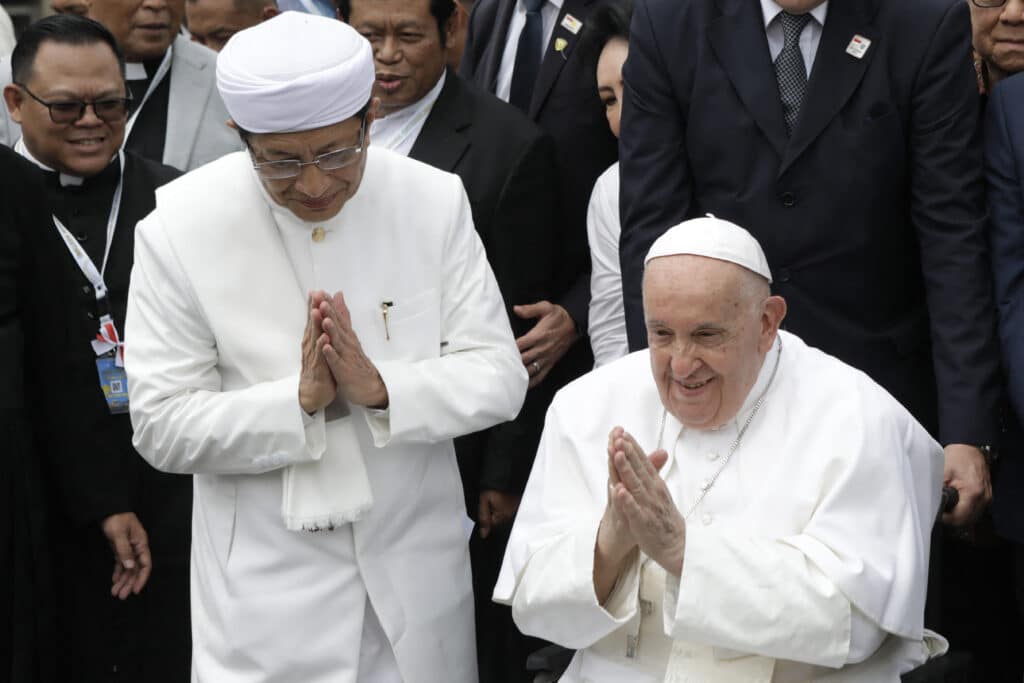 Grand Imam of Istiqlal Pope, Indonesia imam make joint call to fight violence. Mosque Nasaruddin Umar (L) and Pope Francis react after a family photo following an interreligious meeting with religious leaders at the Istiqlal Mosque in Jakarta on September 5, 2024. | Photo by Aditya AJI / POOL / AFP