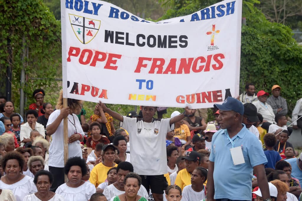 Pope on landmark tour welcomed by ‘blessed Papua New Guinea . In photo are people waiting for the arrival of Pope Francis outside the Port Moresby International airport on September 6, 2024.| Photo by Andrew KUTAN / AFP