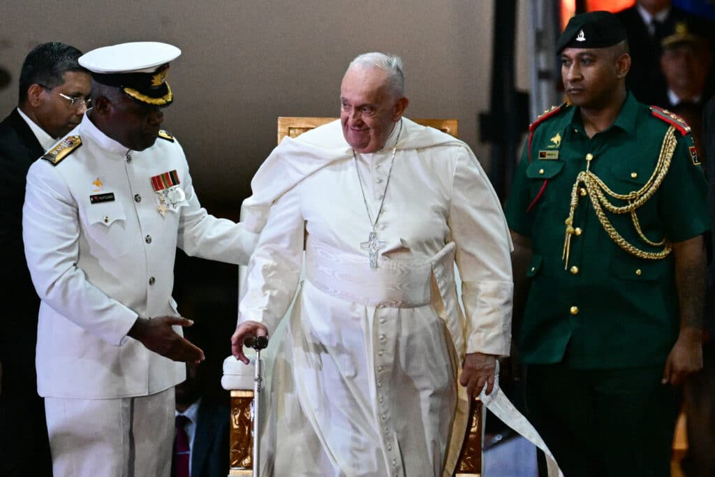 Pope Francis takes part in a welcome ceremony upon arrival at the Port Moresby International airport on September 6, 2024. Pope Francis landed in Papua New Guinea's Port Moresby on September 6, the second stop of a marathon 12-day tour to the Asia-Pacific region. (Photo by Tiziana FABI / AFP)