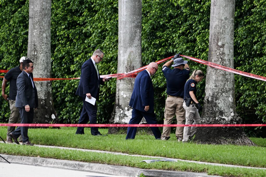 Trump blames Biden, Harris 'rhetoric' for assassination attempts. In photo are law enforcement officials working at the crime scene outside the Trump International Golf Club in West Palm Beach, Florida, on September 16, 2024, following Sunday's attempted assassination on former US President and Republican presidential candidate Donald Trump. |Photo by CHANDAN KHANNA / AFP