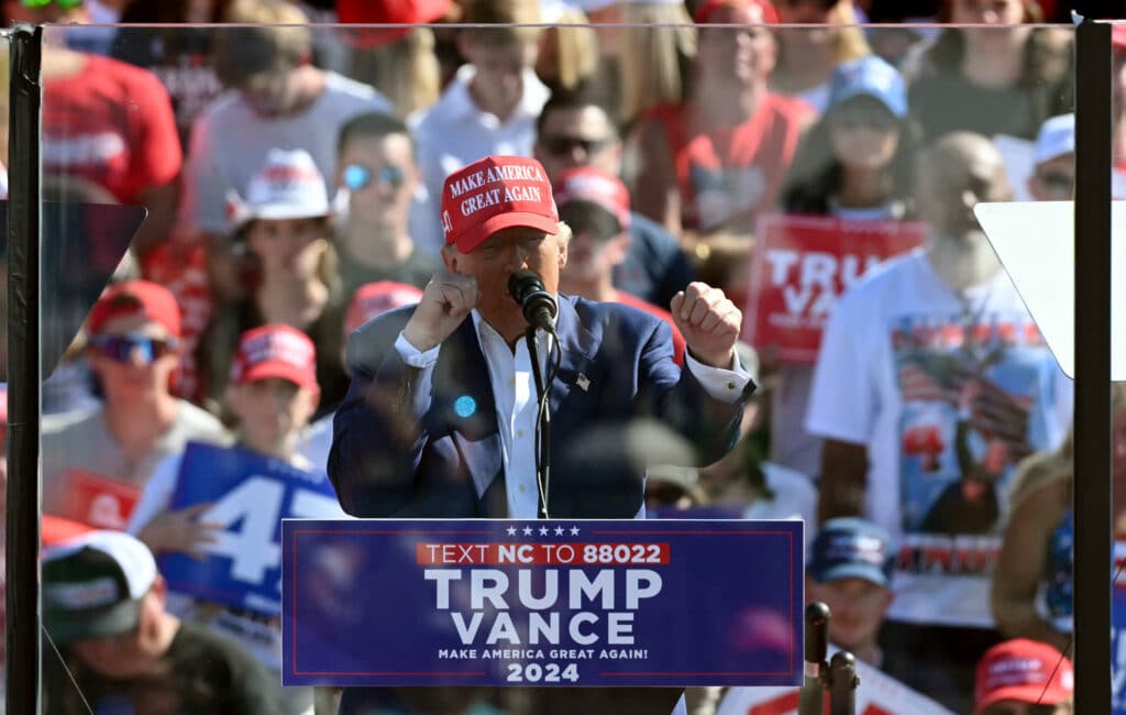 Trump merch on sale: Bibles, sneakers, silver coins. In photo is former US President and Republican presidential candidate Donald Trump speaking during a campaign rally at the Aero Center in Wilmington, North Carolina, September 21, 2024. |Photo by Jim WATSON / AFP