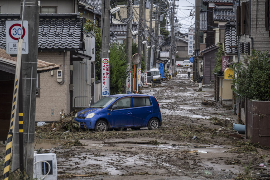 Floods, landslides hit C. Japan: 1 dead, 11 missing. In photo is a stranded car is seen in a mud-covered road following heavy rain in Wajima city, Ishikawa prefecture on September 22, 2024. | Photo by Yuichi YAMAZAKI / AFP