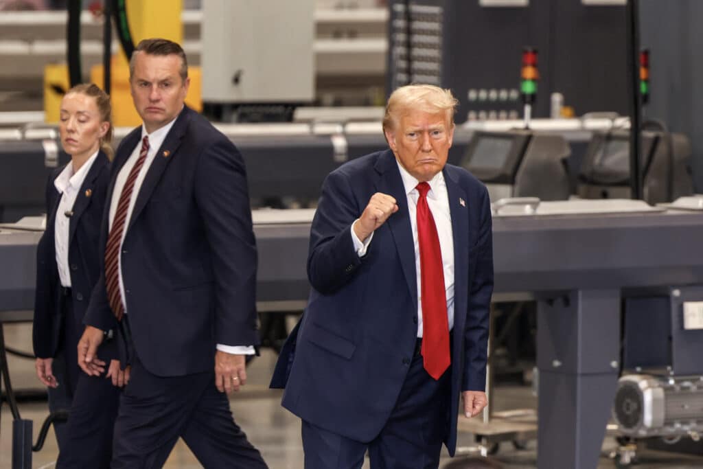 Trump: I would destroy Iran if it 'harms' a US election candidate. In photo is former US President and Republican presidential candidate Donald Trump gesturing as he departs after concluding his remarks during a campaign event in Mint Hill, North Carolina, on September 25, 2024. | Photo by Logan Cyrus / AFP