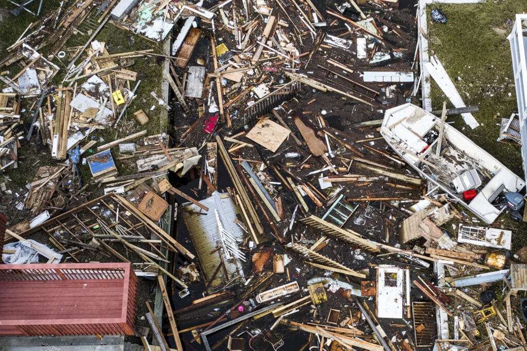 Storm Helene: Death toll soars in US, North Carolina reeling, An aerial view of debris of damaged houses are seen after Hurricane Helene made landfall in Horseshoe Beach, Florida, on September 28, 2024. | Photo by CHANDAN KHANNA / AFP