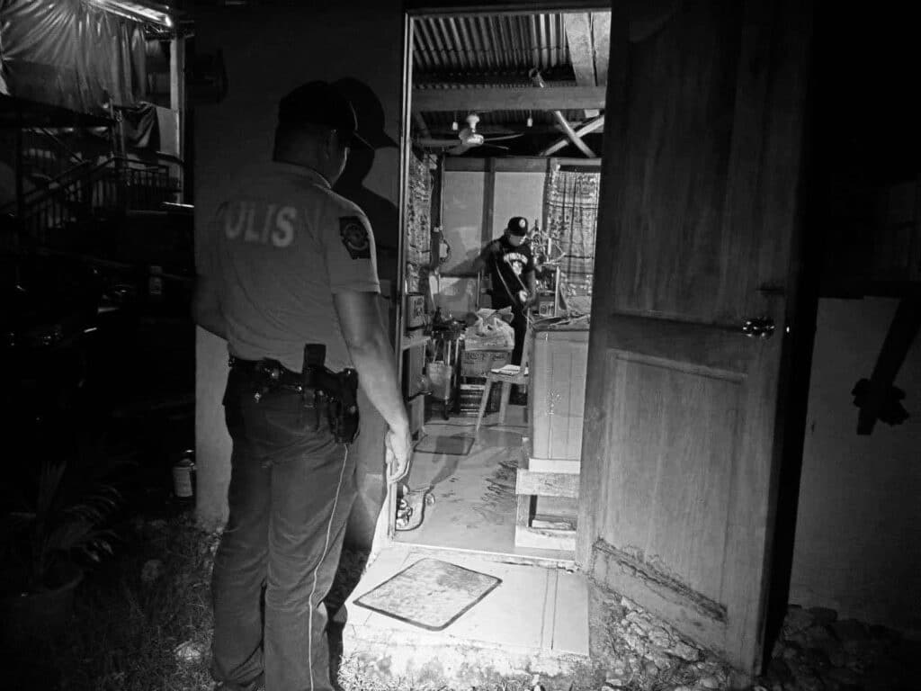 Sibonga killing: Man dies after he was shot while answering door. In photo, police are processing the crime scene where a man was shot dead after he answered the knock on the door of his rented house in  Sibonga town in southern Cebu.