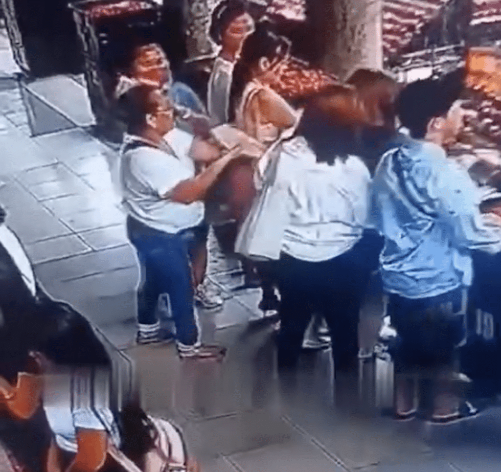 Pickpockets in Basilica identified, hot pursuit ongoing. In photo is the group of pickpockets caught on camera stealing from a devotee at the Basilica Minore del Sto. Niño de Cebu. | screen grab from video of Nor Riv via Futch Anthony Inso #CDNDigital