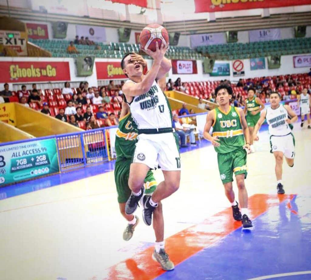 Marvin Ravelo is fouled hard by a USC defender during their Cesafi Season 24 game. | Photo from Sugbuanong Kodaker