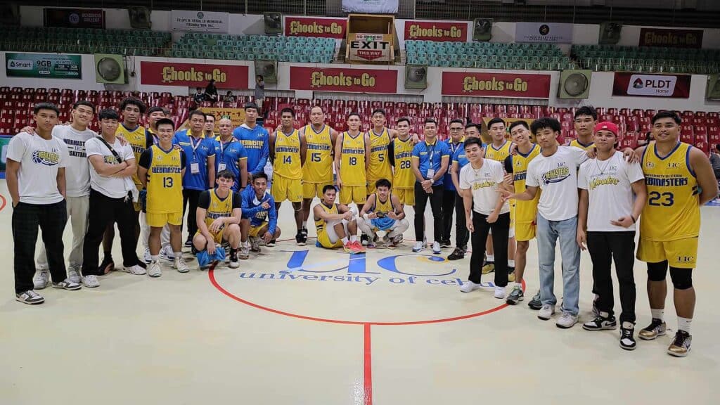 UC Webmasters players and coaching staff proudly pose for a group photo after beating the USJ-R Jaguars. | By Glendale Rosal