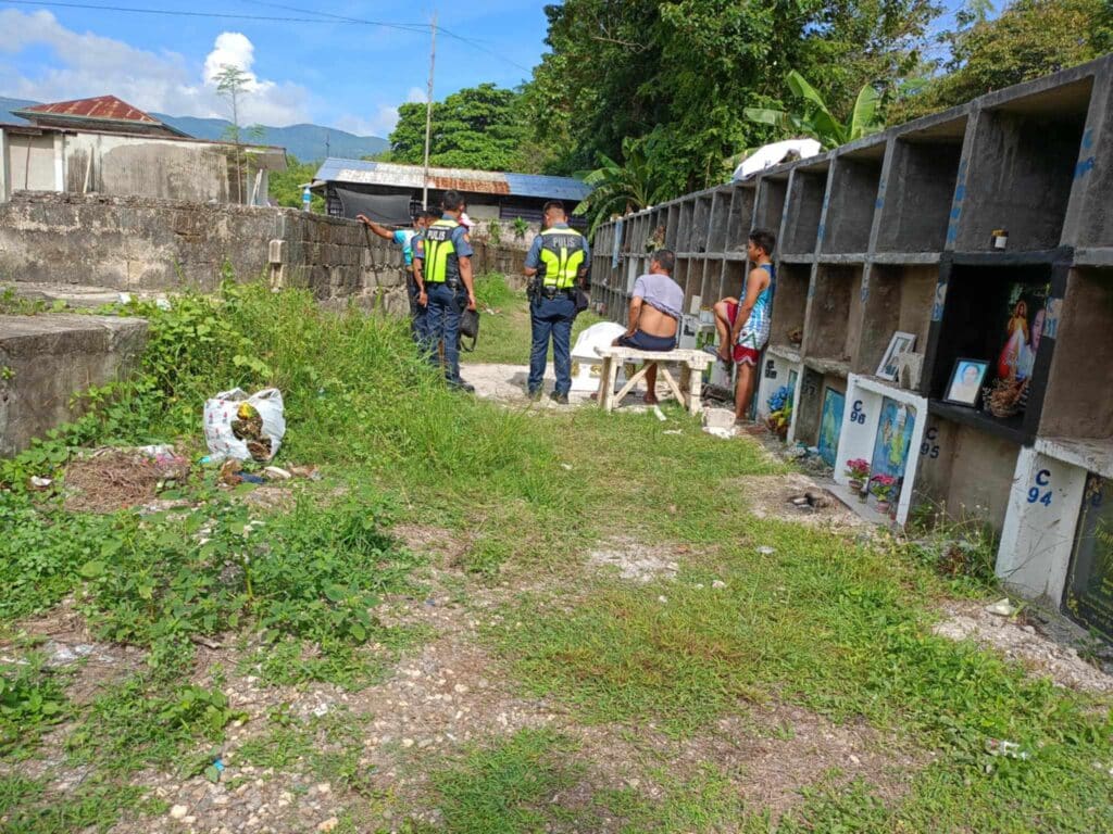 Carcar, Cebu: Cops have 'POIs' on possible ‘necrophilia’ case. Police respond to the reported call about the casket with a dead woman inside being removed outside her tomb . | Contributed photo via Futch Anthony Inso