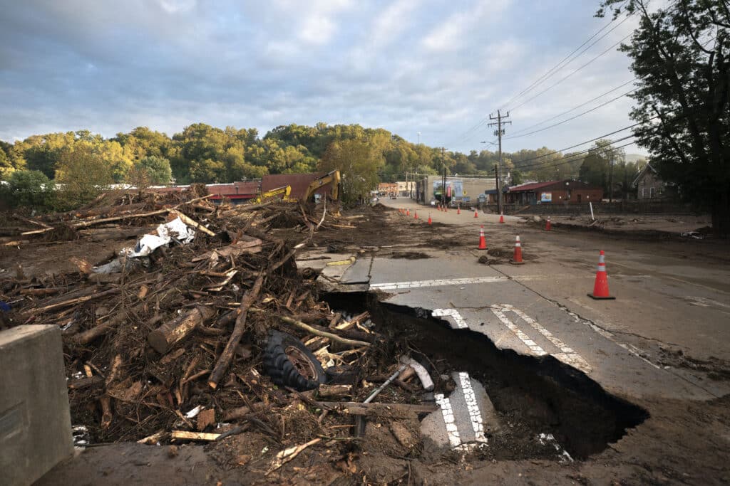 Flood damage at a bridge across Mill Creek in the aftermath of Hurricane Helene on September 30, 2024 in Old Fort, North Carolina.| Sean Rayford / Getty Images via AFP