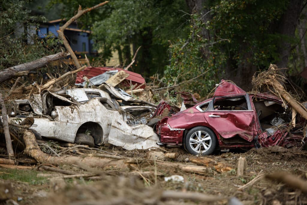 Hurricane Helene death toll hits 130. Vehicles uncovered after days in debris lay near what used to be Mill Creek in the aftermath of Hurricane Helene on September 30, 2024 in Old Fort, North Carolina. | Photo by Melissa Sue Gerrits / Getty Images via AFP