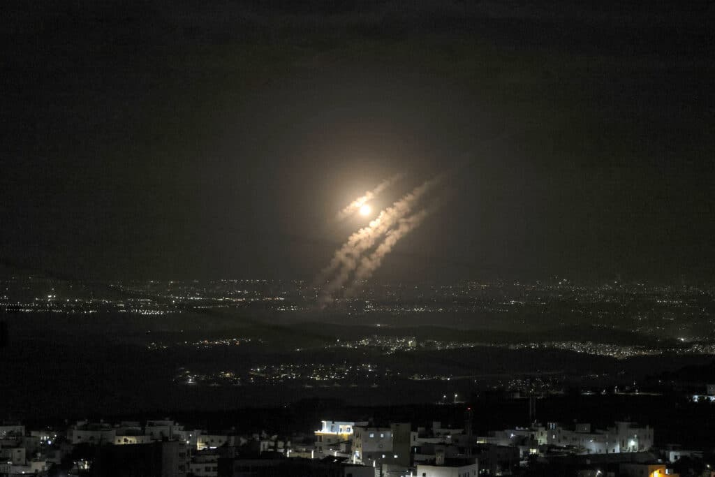 Iran fires at least 180 missiles into Israel, Mideast conflict grows, This picture isn taken from the West Bank city of Hebron shows projectiles above the Israeli city of Ashdod on October 1, 2024.  | Photo by HAZEM BADER / AFP