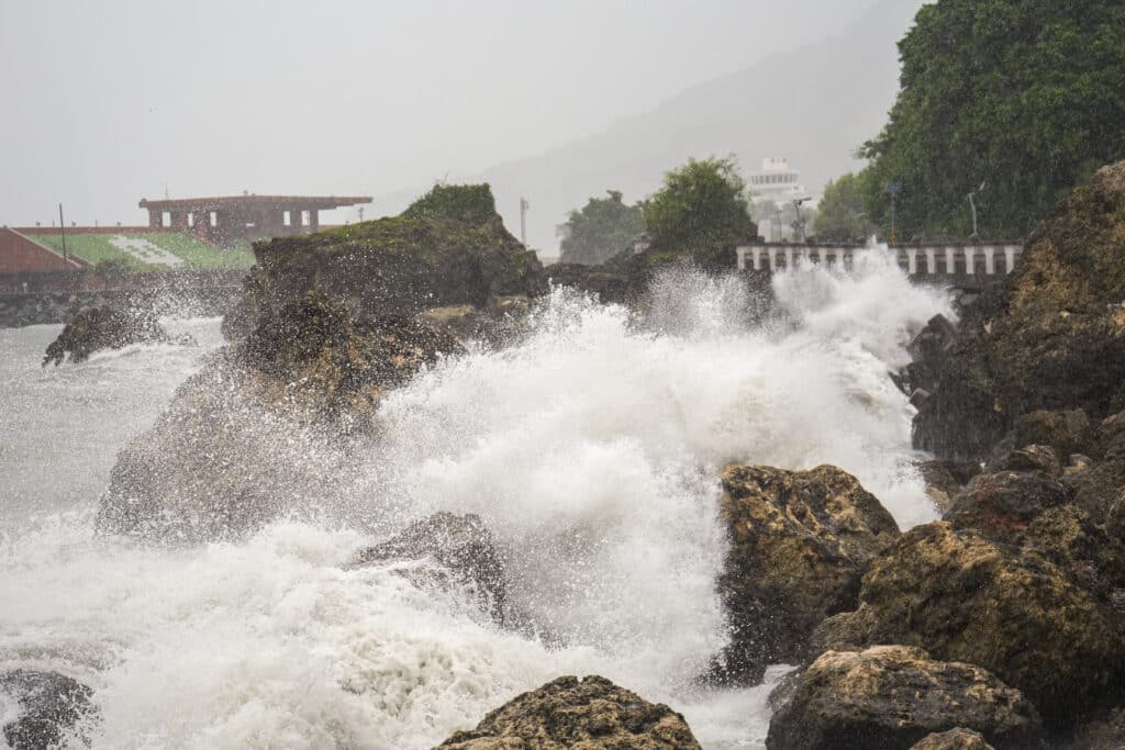 Typhoon Krathon makes landfall: Taiwan shuts down for second day, In photo are waves breaking against the coast at Sizihwan beach in Kaohsiung on October 2, 2024. | Photo by WALID BERRAZEG / AFP