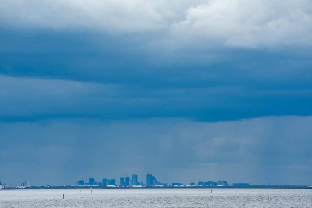 A thunderstorm can be seen moving over Tampa in the distance from St. Petersburg, Florida ahead of Hurricane Milton's expected landfall in the middle of this week on October 8, 2024. | Photo by Bryan R. SMITH / AFP