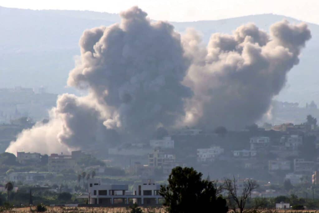 Israel PM threatens Lebanon with destruction 'like Gaza'. In photo shows smoke cloud erupting following an Israeli air strike on a village near Lebanon's southern city of Tyre on October 9, 2024. | Photo by Kawnat HAJU / AFP