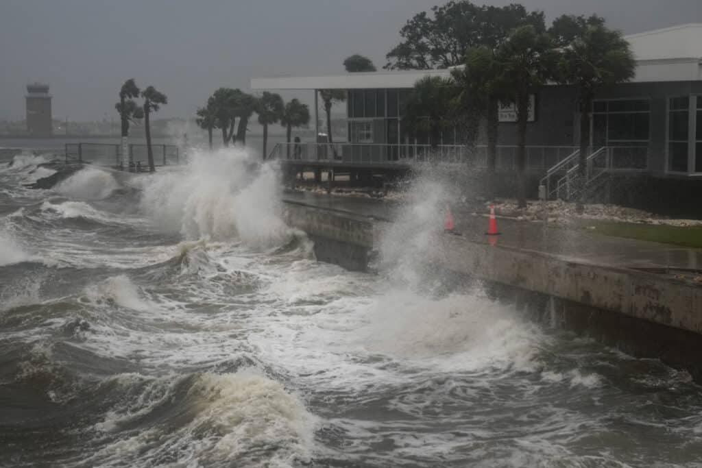 Waves crash along St. Pete Pier in St. Petersburg, Florida, as Hurricane Milton is expected to make landfall tonight on October 9, 2024. | Photo by Bryan R. SMITH / AFP