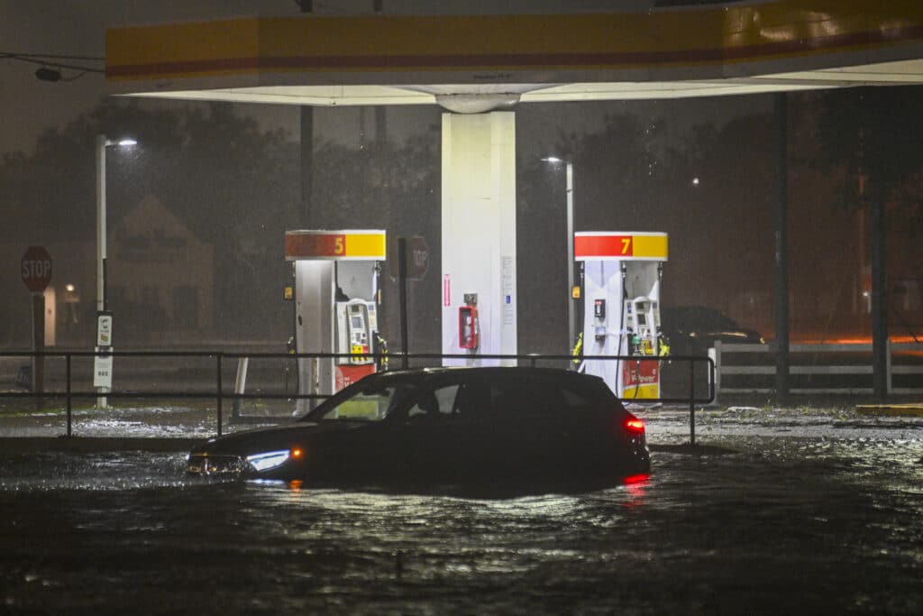 A vehicule is stranded on a water-flooded street after Hurricane Milton made landfall in Brandon, Florida on October 9, 2024. | Photo by Miguel J. Rodriguez Carrillo / AFP)