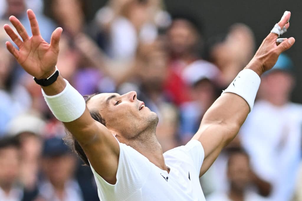 (FILES) Spain's Rafael Nadal celebrates winning against US player Taylor Fritz after winning his men's singles quarter final tennis match on the tenth day of the 2022 Wimbledon Championships at The All England Tennis Club in Wimbledon, southwest London, on July 6, 2022. | Photo by Glyn KIRK / AFP